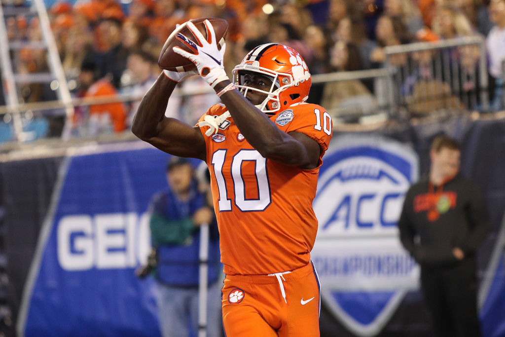 Joseph Ngata catching a football.